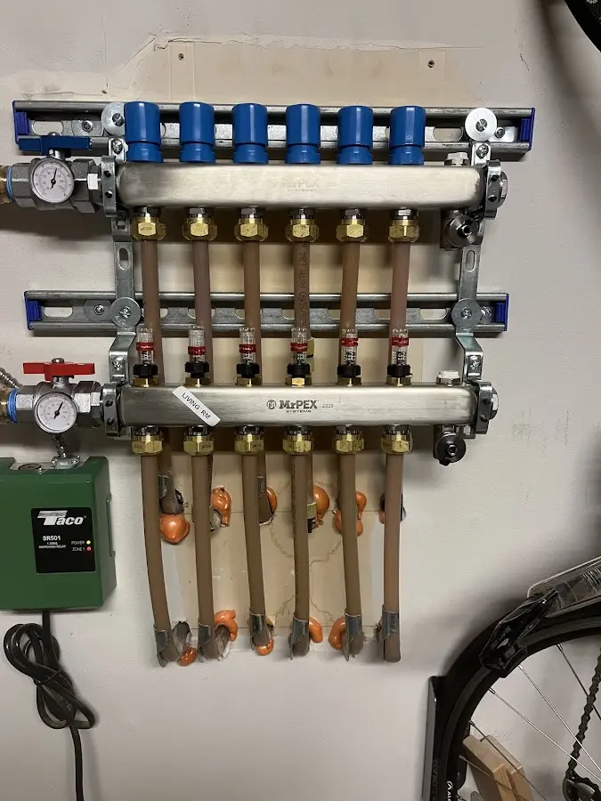 Plumber performing Water Heater Repair at a residential property in Dryden